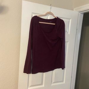 Purple/maroon colored blouse.
